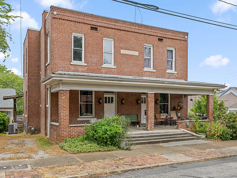 The builder built this duplex for his wife, and therefore the name on the building is "The Lucretia".