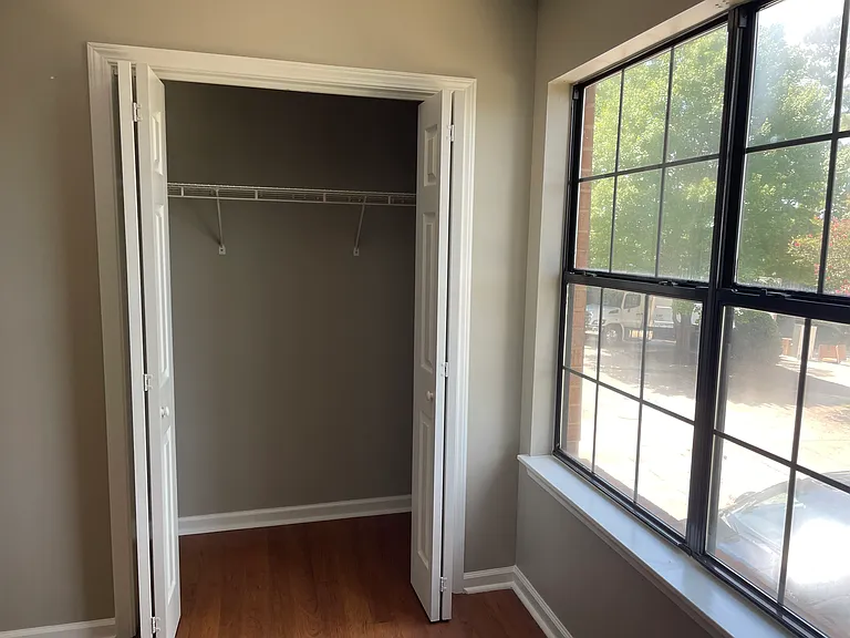 Large bedroom closet offers plenty of room for clothes and storage