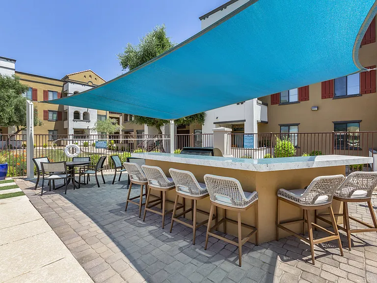 Poolside BBQ area at Trevi Apartment Homes
