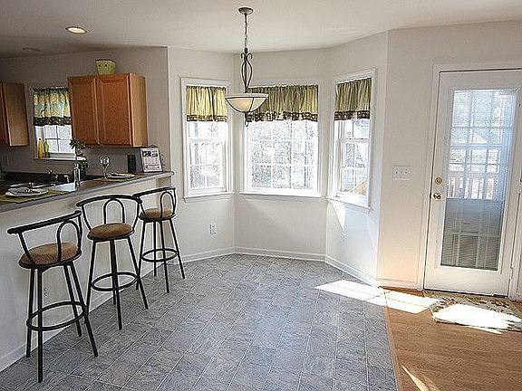 Seperate Eat In Area with view of Wooded Fenced Yard from Bay Window