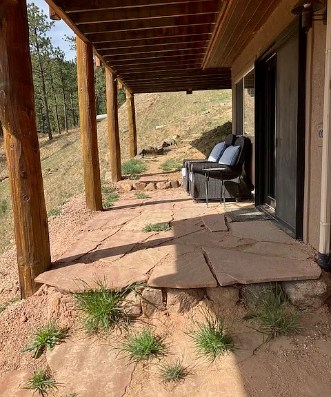 Full view of the patio. Your entrance is the french doors, which is next to the patio chairs.