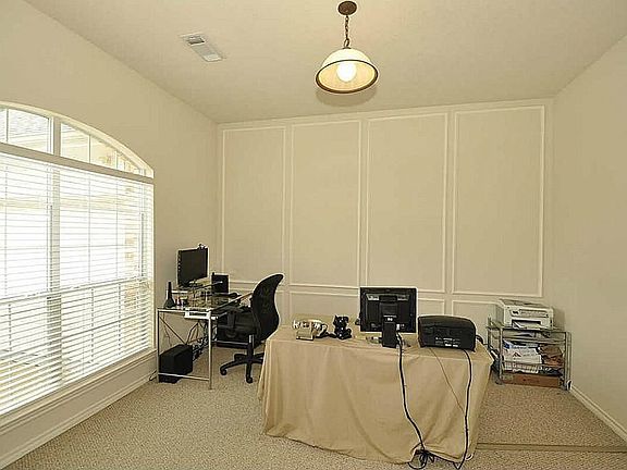 Large window plus extra transoms makes this study extra bright & the view to front yard enables time spent here enjoyable!