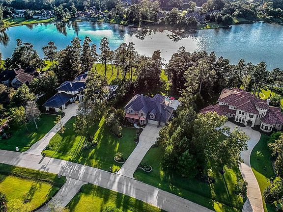 This acreage Custom Home Community has some of the lowest taxes in the area. Finding a 4000 sq. ft home with pool on the lake in the Estates under 900K does not happen very often.