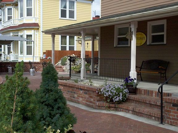 Front Suite
						:
						neighbors turn of the century house next door