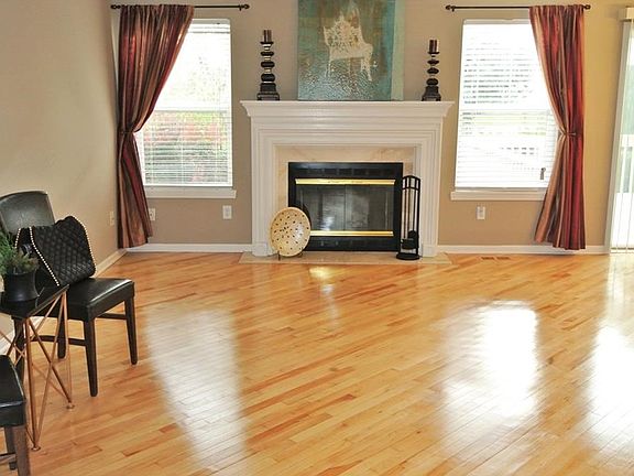 Oversized Great room with wood burning fireplace.  Hardwoods have been resurfaced to look like new again!