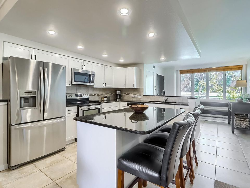 Large kitchen with upgraded appliances and granite countertops.