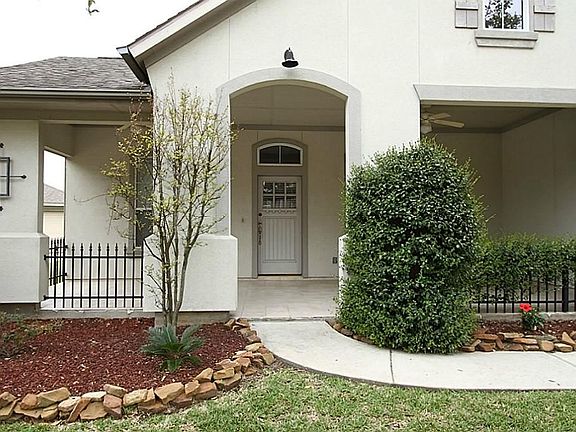 With amazing curb appeal, this home showcases a neutral two-tone stucco exterior with iron decorative fencing, double pane windows...