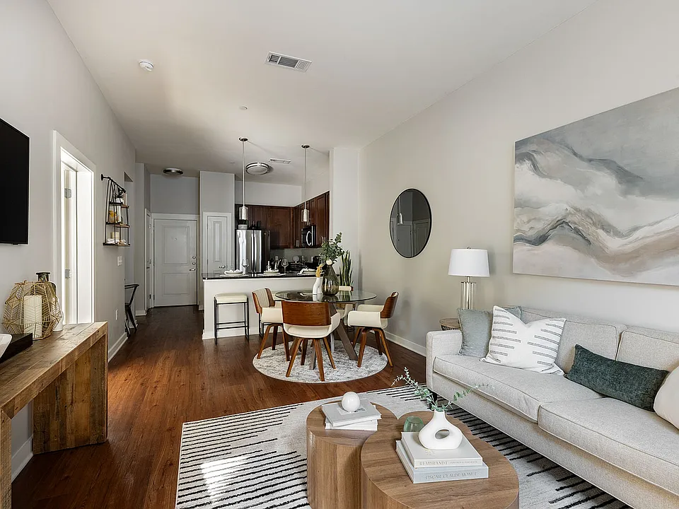 Spacious living room & dining area with hardwood-style flooring
