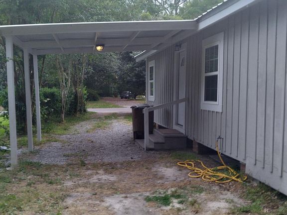 Covered, attached parking for one small car