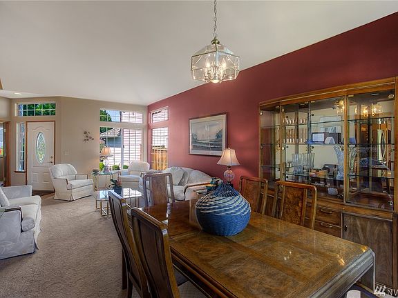 Vaulted ceilings in living room and dining room. Custom windows. Lots of natural light. 