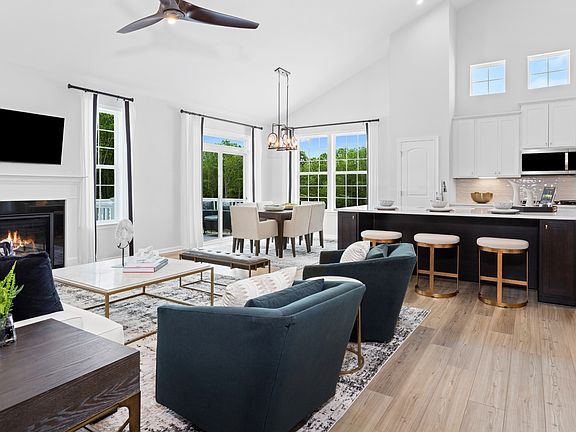 Open main floor with vaulted ceiling in a DRB Homes Aspen II model at the Deerfield Preserve commun