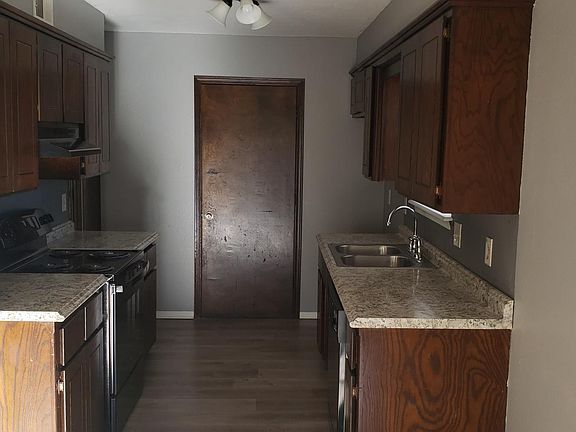 Kitchen includes electric oven/stove range, dishwasher and updated counter tops.
