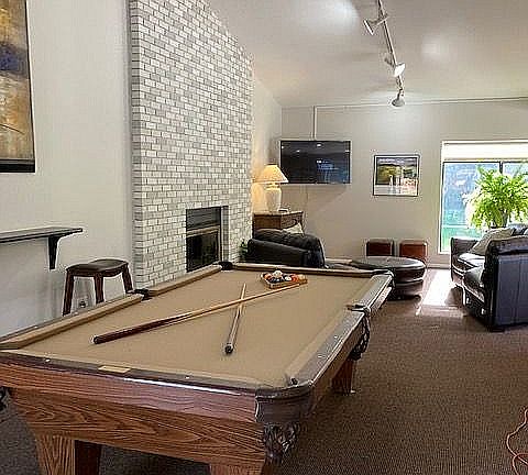 Experience the perfect blend of relaxation and entertainment in this inviting lounge space.