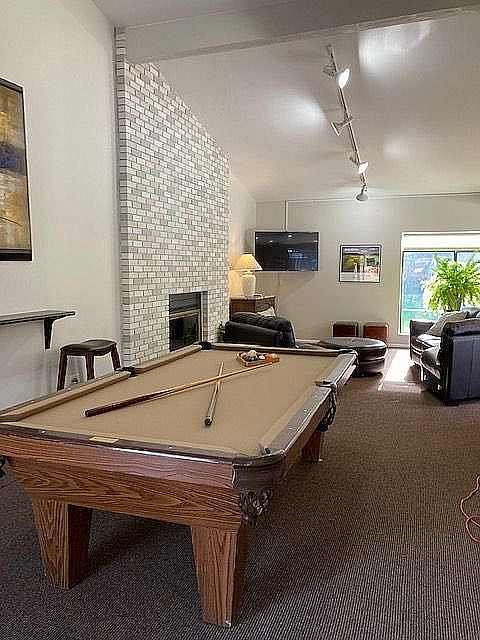Experience the perfect blend of relaxation and entertainment in this inviting lounge space.