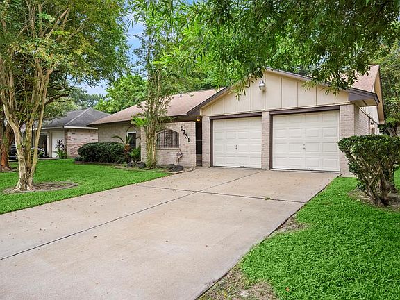 Double wide driveway for ample parking leading to the 2 car attached garage