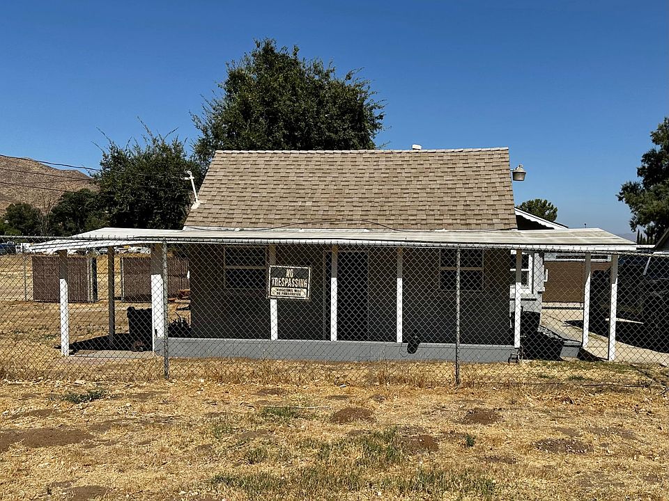Front of house with overview of land to the left and right of the house. Completely gated.