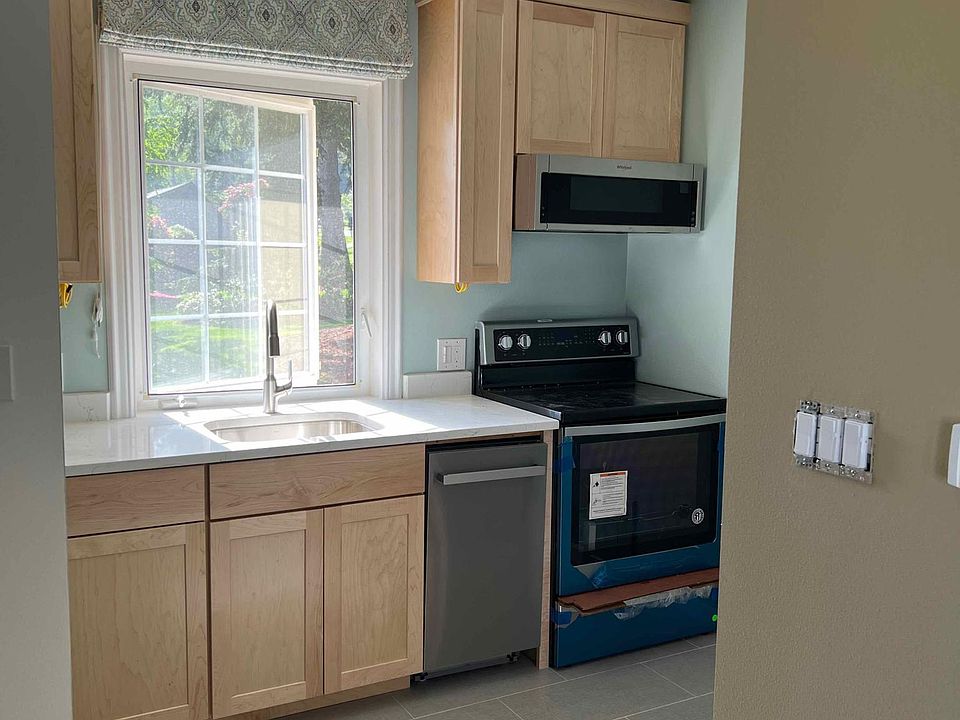 newer kitchen with high end finishes and appliances