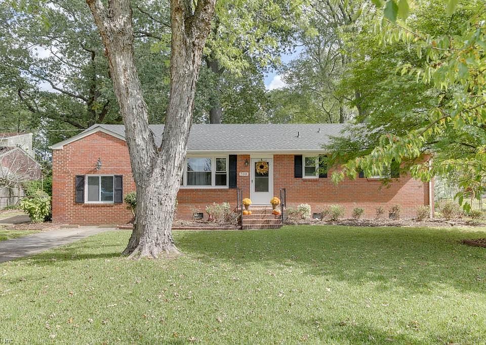 Updated 4 bedroom brick ranch on a large lot with mature landscaping