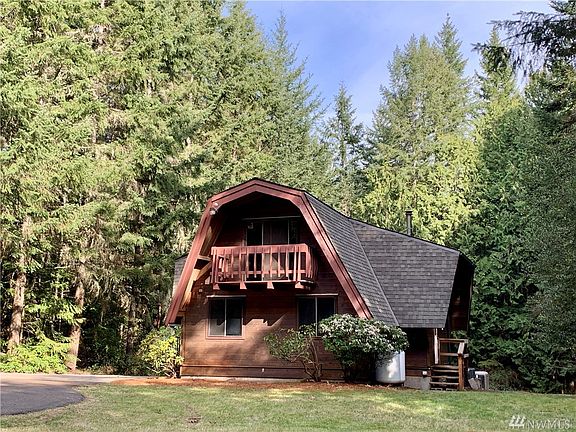 Late afternoon sun just shines on this solid cedar home.