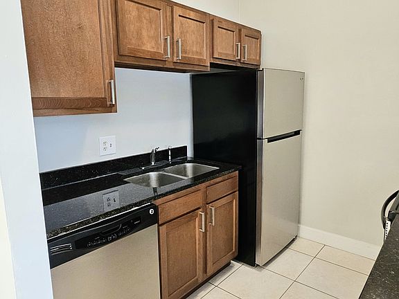 Kitchen features Granite Counter Tops and Stainless Steel Appliances