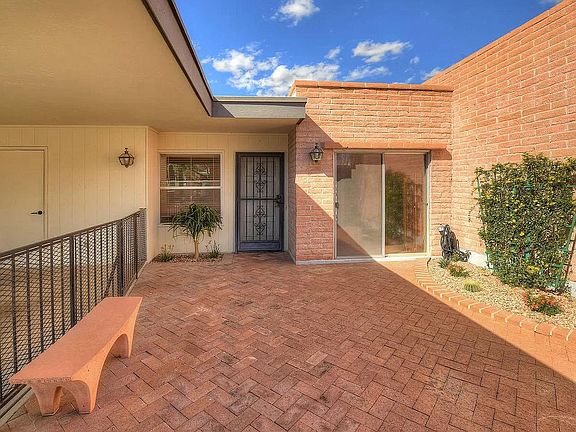 Enclosed paved courtyard with automatic drip system