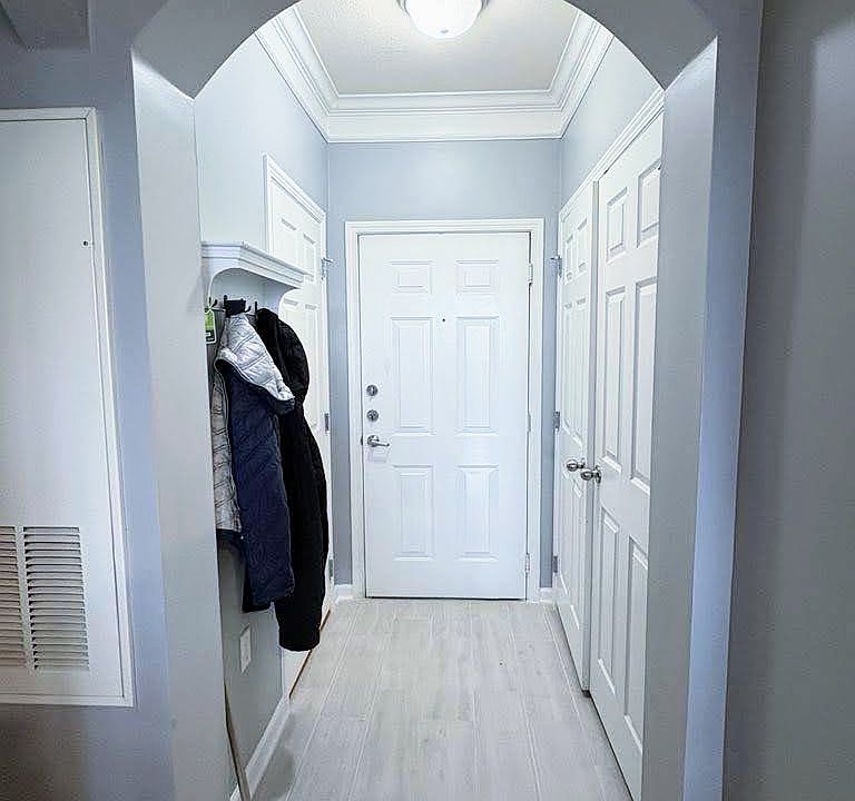 Condo Entrance, new floor (washing/dryer on the right and closet to left)