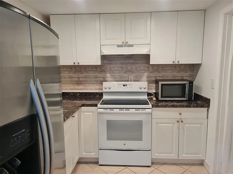 300 Golden Isles Dr #104 — Photo 3