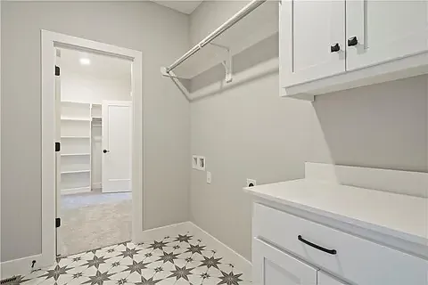 Laundry room located off the primary closet