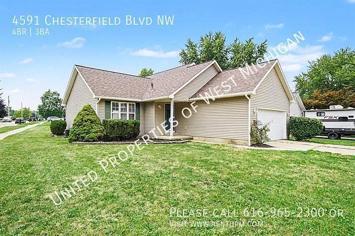 Available Now | 4 Bed 3 Bath Single Family Home in Walker | 2 Stall Garage | Back Patio | Lower L... — Photo 3