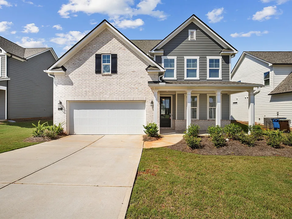 Hickory C Layout - front exterior view with attached 2-car garage and front porch