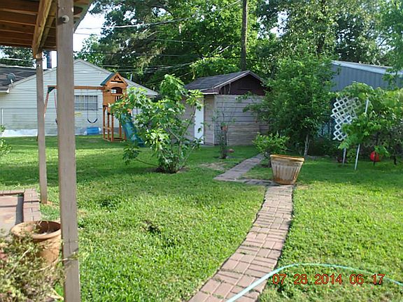View from patio to storage shed in back yard
