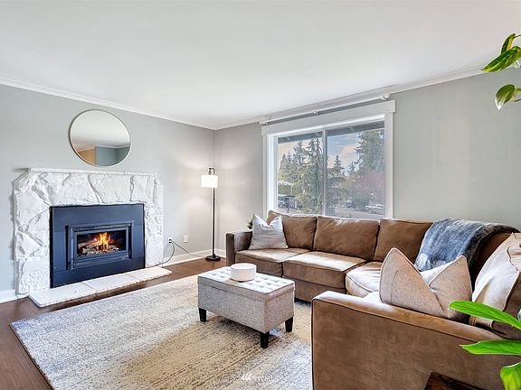 Head on inside and be greeted by this welcoming living room with gas fireplace ready for your Friday night movie marathon!