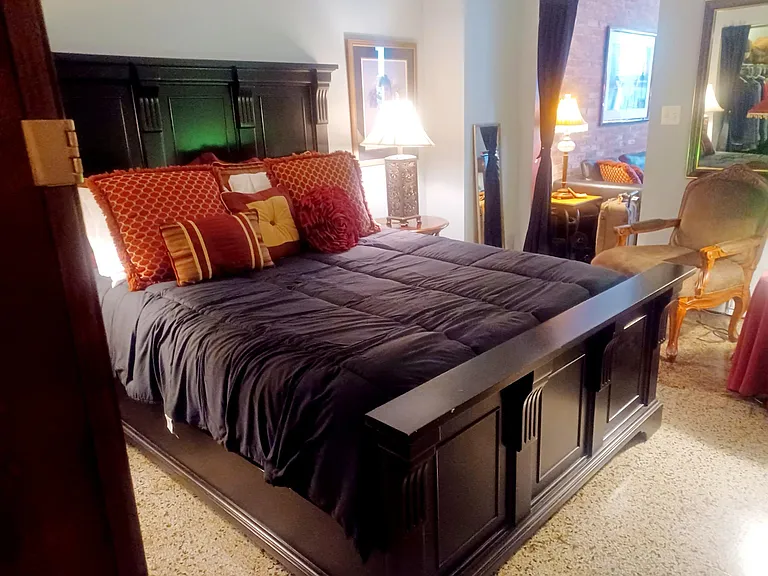 Bedroom With Very Large Custome Shelved Closet