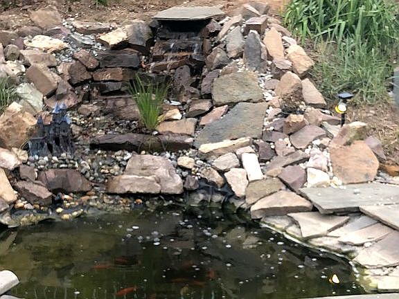 Outdoor pond with waterfall