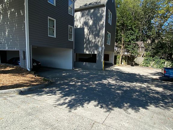 Back of building with private additional parking area