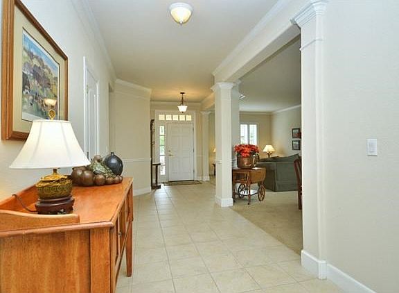 A tiled Gallery Foyer is a perfect place to display art, or collections.