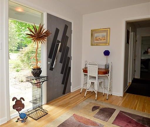 Lots of light in this Welcoming 11'x7' Foyer. Hardwood floors,