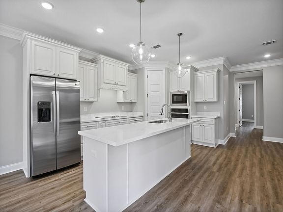 Kitchen in the Taylor floorplan at a Meritage Homes community in Gulfport, MS.