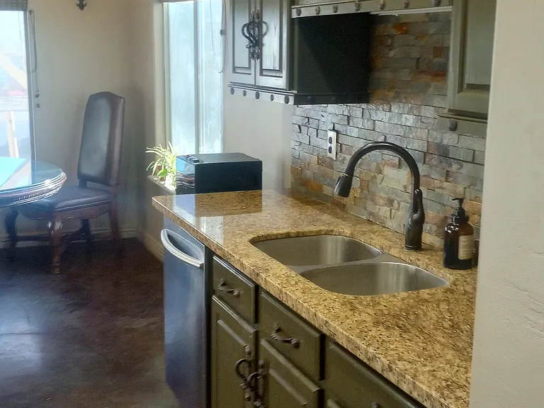 Granite Countertops, Dishwasher, custom cabinets.