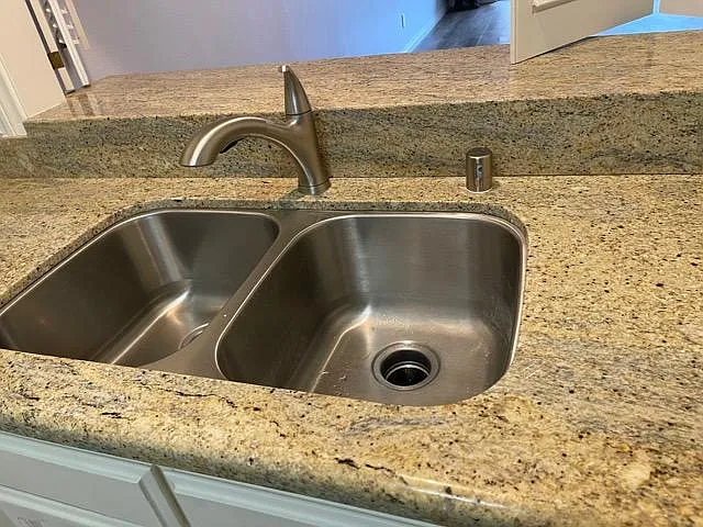 Sink with garbage disposal and brand new faucet with extendible neck