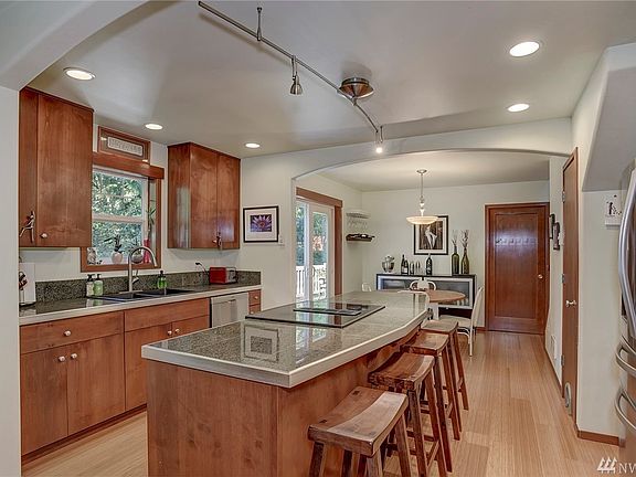 The kitchen is the heart of this house. Granite counters, stainless appliances and plenty of space! 