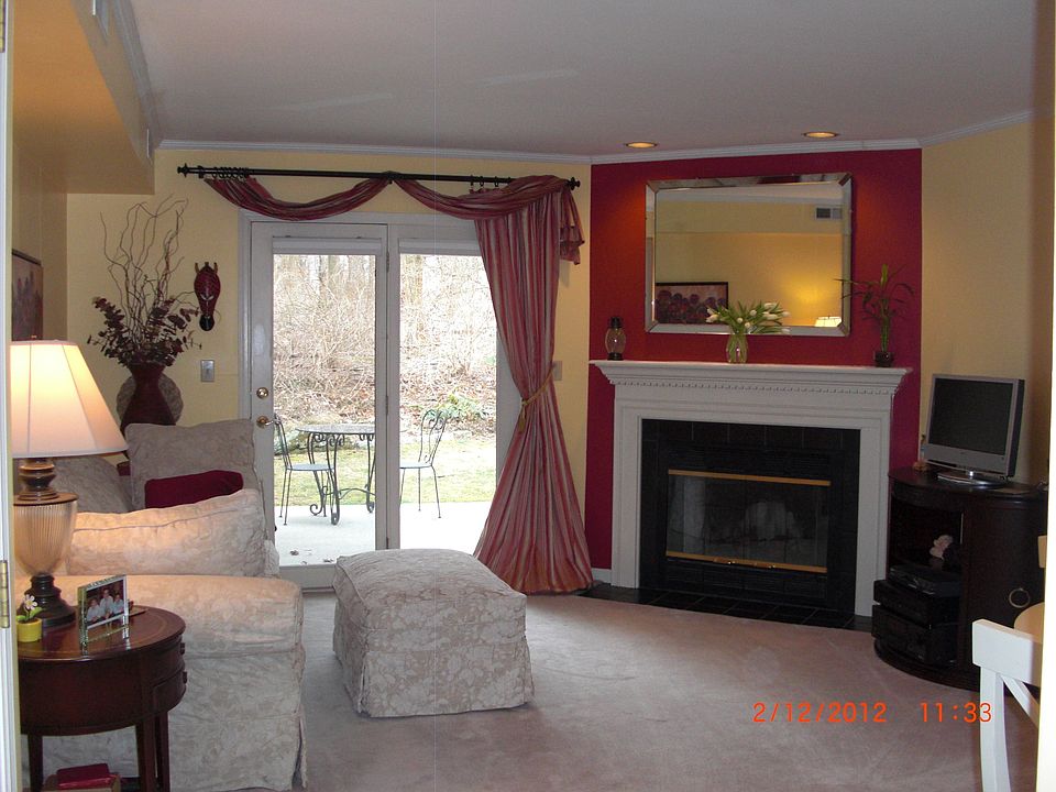 Living Room with fireplace, door to patio