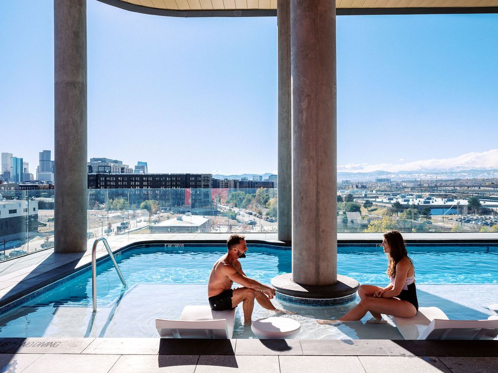 Luxurious heated pool + spa on 5th floor overlooking the city and mountains