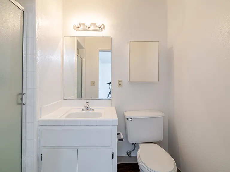 Bathroom #2 with walk-in shower and efficient layout.