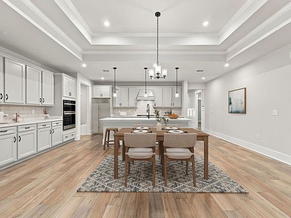Elegant dining room in the Azle floorplan with easy access to the kitchen.