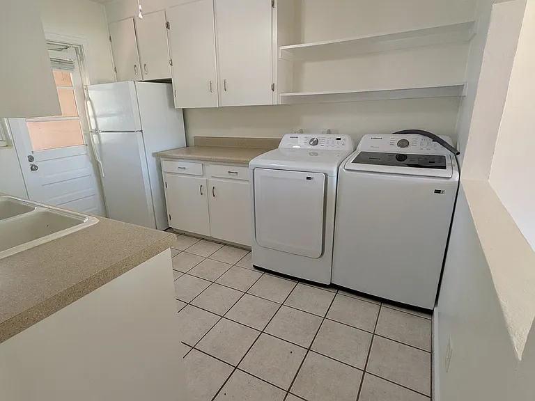 This is a view of the kitchen as you enter the room.