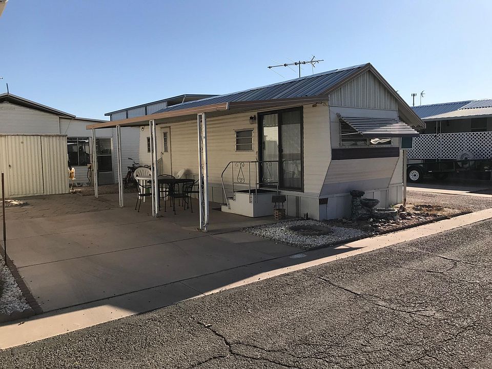 View from the Street - Parking for car and covered patio.