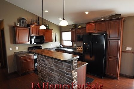 Large open kitchen with custom stone island.