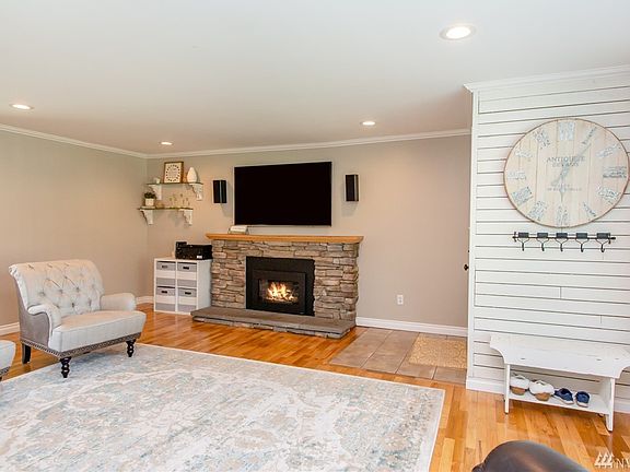 Beautiful touches throughout .. beginning with the  restored hardwoods, propane fireplace and freshly painted walls that greet you as you enter the living room of this adorable home.