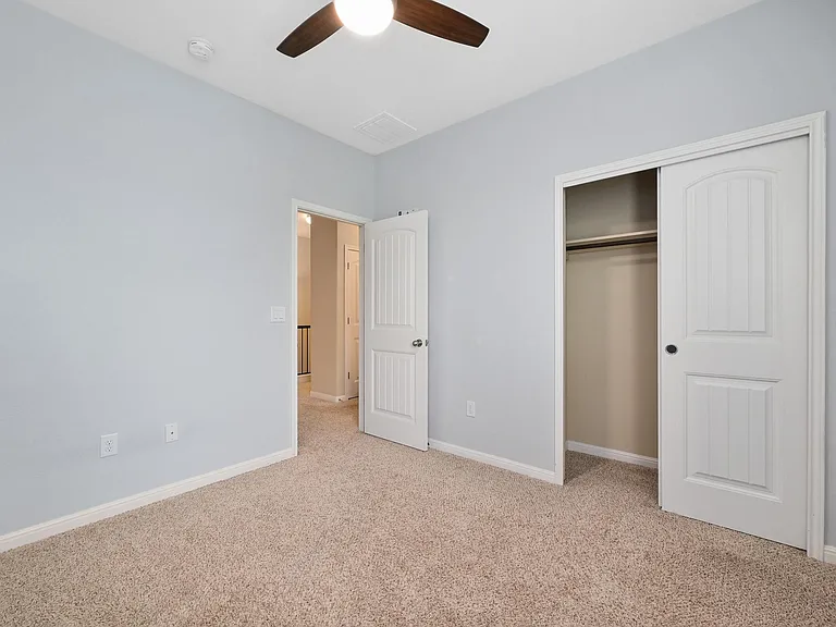 Bedroom 3 with view of closet